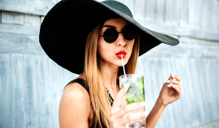 young attractive woman in a black floppy hat with a cocktail-579be18b38865.jpg